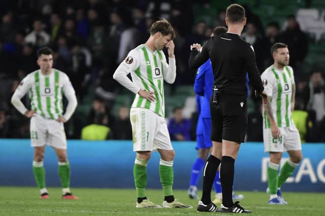 Real Betis defender Juan Miranda reacts at full-time following Rangers' 3-2 win at the Benito Villamarin Stadium. (Photo by CRISTINA QUICLER/AFP via Getty Images)