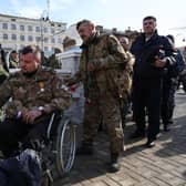 Attendees, including relatives of fallen participants in the Russian military action in Ukraine, take part in the opening ceremony of the obelisk in honour of the fallen heroes of the invasion of Ukraine, in Crimea, last week. Picture: AFP via Getty Images