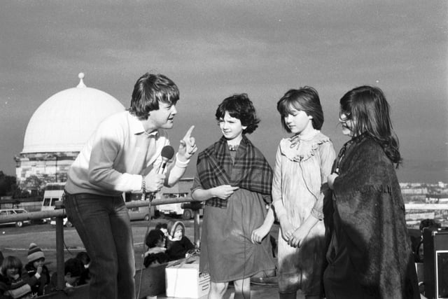Presenter Keith Chegwin chats to some children from Edinburgh Theatre Workshop when the Swap Shop television programme was filmed on Calton Hill in February 1982.