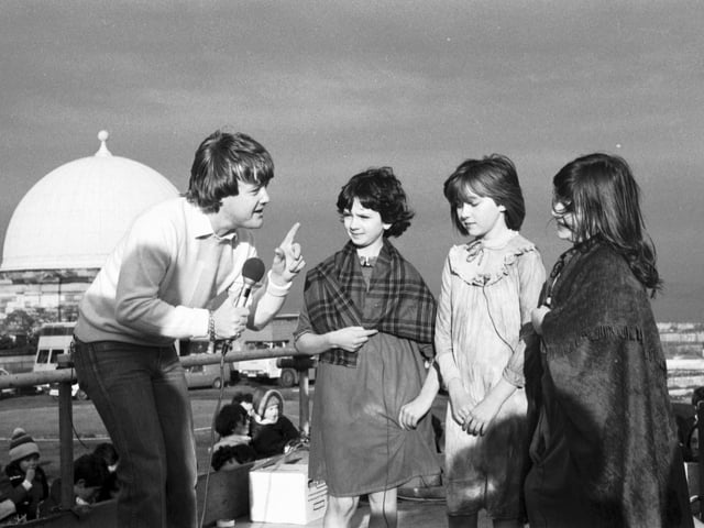Presenter Keith Chegwin chats to some children from Edinburgh Theatre Workshop when the Swap Shop television programme was filmed on Calton Hill in February 1982.