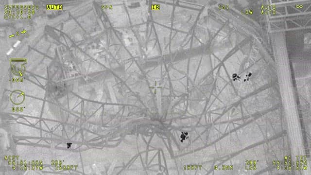 An image taken from the helicopter saw the four people climbing on the roof (Pic: Police Scotland Air Unit)