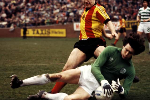 Saving for Celtic at the feet of Partick Thistle's Donald Park
