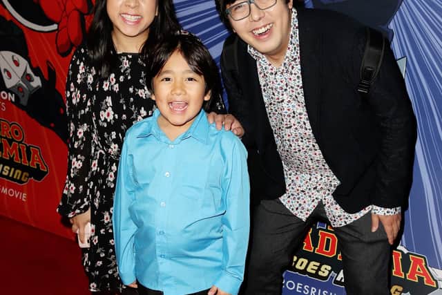 Child influencer Ryan Kaji with his parents Loann and Shion at a film premiere. The ten-year-old has close to 31 million subscribers on YouTube