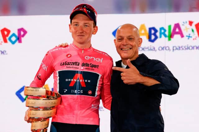 Tao Geoghegan Hart celebrates his Giro d'Italia win with Ineos Grenadiers chief Sir David Brailsford.