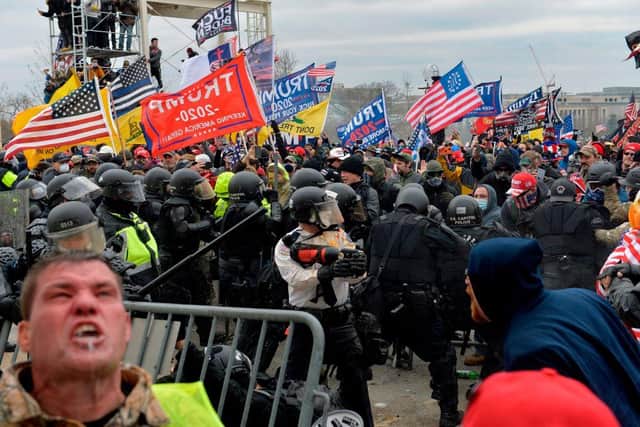 Trump supporters clash with police and security forces as they try to storm the US Capitol Building in Washington DC on 6 January 2021 (Photo: JOSEPH PREZIOSO/AFP via Getty Images)