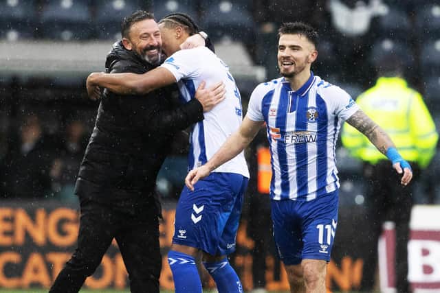 Kilmarnock manager Derek McInnes celebrates with his players after beating Celtic 2-1 at Rugby Park.