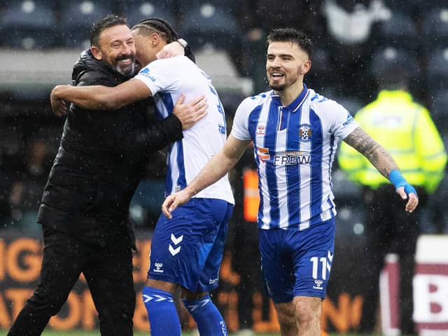 Kilmarnock manager Derek McInnes celebrates with his players after beating Celtic 2-1 at Rugby Park.