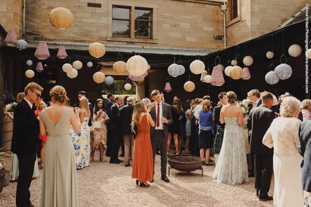 Wedding party in the Coach Yard at Cambo House Pic: Anna Urban Photography