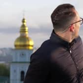 The moment BBC reporter Hugo Bachega in Kyiv has to duck as a missile soars overhead before a loud explosion is heard nearby.