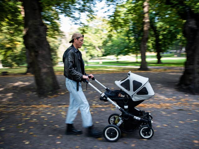 Fathers could use more paternity leave to help look after their babies (Picture: Jonathan Nackstrand/AFP via Getty Images)