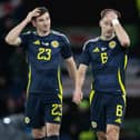 Scotland's Kieran Tierney and Kenny McLean look dejected after the 1-0 defeat to Northern Ireland. (Photo by Ross Parker / SNS Group)