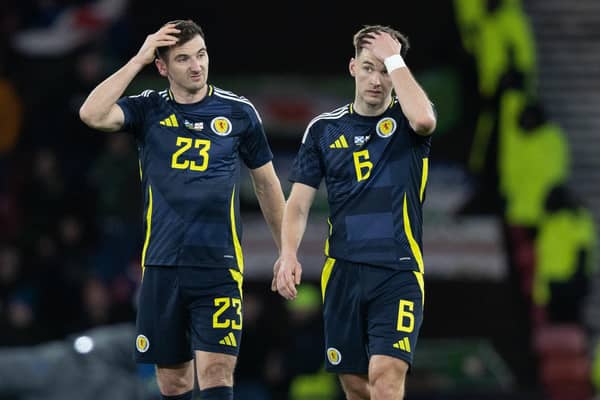 Scotland's Kieran Tierney and Kenny McLean look dejected after the 1-0 defeat to Northern Ireland. (Photo by Ross Parker / SNS Group)