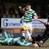 Celtic's Giorgios Giakoumakis (centre) makes it 3-0 during a Scottish Cup match between Dundee United and Celtic.