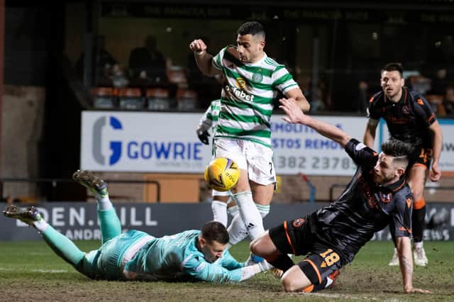 Celtic's Giorgios Giakoumakis (centre) makes it 3-0 during a Scottish Cup match between Dundee United and Celtic.