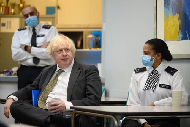 Prime Minster Boris Johnson speaks with members of the Metropolitan Police. Picture: Leon Neal/Getty Images