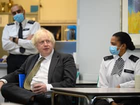 Prime Minster Boris Johnson speaks with members of the Metropolitan Police. Picture: Leon Neal/Getty Images