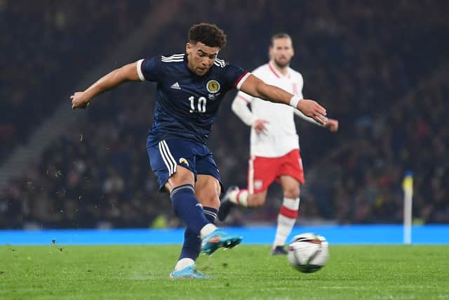 Scotland's Che Adams has a shot on goal against Poland in a friendly that finished 1-1 and raised funds for UNICEF's humanitarian appeal in Ukraine. (Photo by Craig Foy / SNS Group)