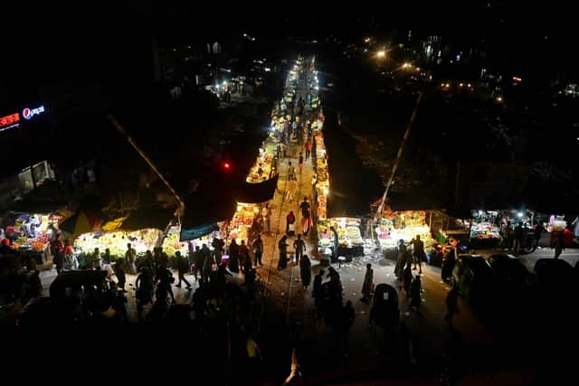 People are pictured along a vegetable and fruit market in Dhaka. Picture: Munir Uz Zaman/AFP via Getty Images