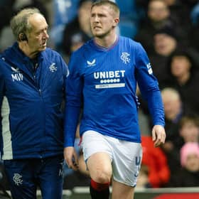 John Lundstram gets treatment from the Rangers physio after picking up an injury against St Johnstone. (Photo by Craig Foy / SNS Group)