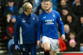 John Lundstram gets treatment from the Rangers physio after picking up an injury against St Johnstone. (Photo by Craig Foy / SNS Group)