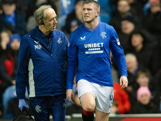 John Lundstram gets treatment from the Rangers physio after picking up an injury against St Johnstone. (Photo by Craig Foy / SNS Group)