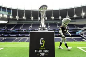 The EPCR Challenge Cup trophy on display at Tottenham Hotspur Stadium as the Sharks mascot walking past prior to the final against Gloucester on May 23. (Photo by Patrick Khachfe/Getty Images)