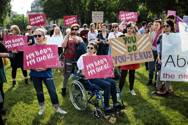 Pro-choice campaigners hold placards outside the Houses of Parliament. Picture: Jack Taylor/Getty Images