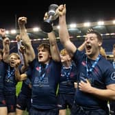 Merchiston's players celebrate with the trophy after defeating Stewart's Melville in the the Scottish Rugby Boys Schools U18 Cup final at BT Murrayfield. (Photo by Ross Parker / SNS Group)