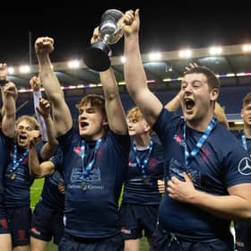 Merchiston's players celebrate with the trophy after defeating Stewart's Melville in the the Scottish Rugby Boys Schools U18 Cup final at BT Murrayfield. (Photo by Ross Parker / SNS Group)