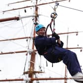 Lorraine Kelly abseils from the mast of the RRS Discovery at Discovery Point in Dundee. Picture: Andrew Milligan/PA Wire