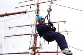 Lorraine Kelly abseils from the mast of the RRS Discovery at Discovery Point in Dundee. Picture: Andrew Milligan/PA Wire