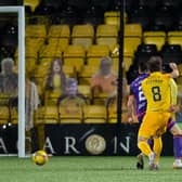 Livingston's Scott Pittman (R) makes it 1-0 during the Scottish Premiership match between Livingston and Dundee United, which finished 2-0 to the home side (Photo by Ross Parker / SNS Group)