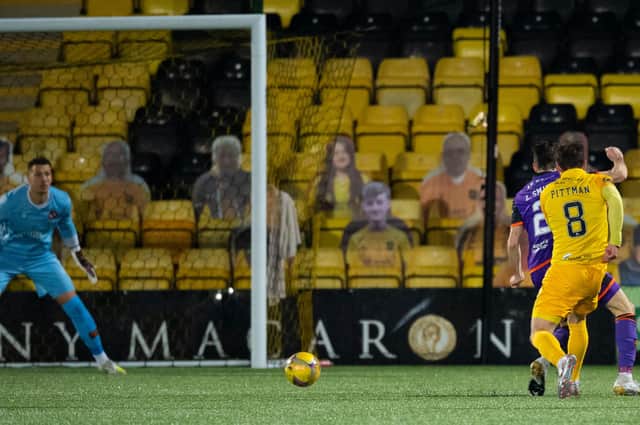Livingston's Scott Pittman (R) makes it 1-0 during the Scottish Premiership match between Livingston and Dundee United, which finished 2-0 to the home side (Photo by Ross Parker / SNS Group)