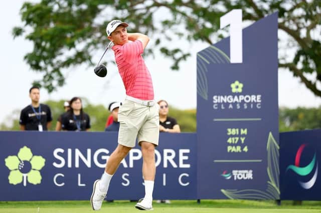Grant Forrest tees off at the first hole in the final round of the Singapore Classic at Laguna National Golf Resort Club. Picture: Yong Teck Lim/Getty Images.