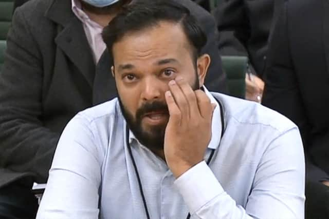 A video grab from footage broadcast by the UK Parliament's Parliamentary Recording Unit (PRU) shows former Yorkshire cricketer Azeem Rafiq fighting back tears while testifying in front of a Digital, Culture, Media and Sport (DCMS) Committee in London on November 16, 2021 as MPs probe racial harassment at the club.