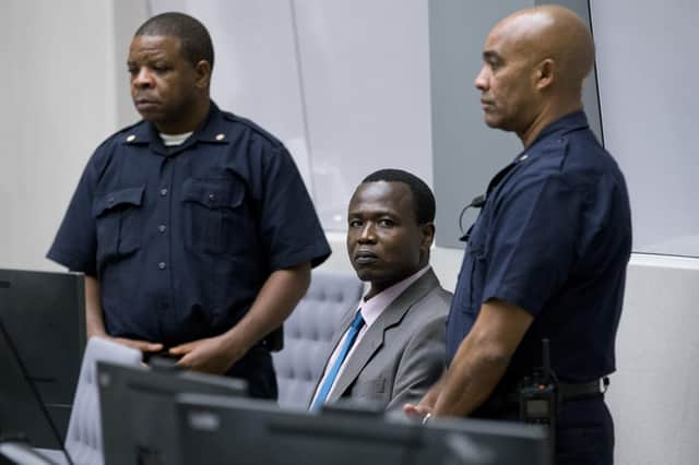 Dominic Ongwen, centre, a senior commander in the Lord's Resistance Army, sits in the International Criminal Court in The Hague (Picture: Peter Dejong/AFP via Getty Images)