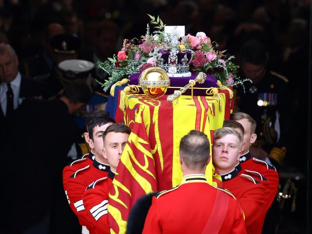 The coffin is carried out following the State Funeral of Queen Elizabeth II, held at Westminster Abbey, London. Picture date: Monday September 19, 2022.
