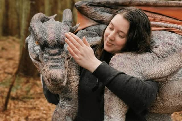 Dragon trainer Laura with one of the realistic dragon puppets which will be heading to Aden.