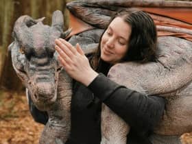 Dragon trainer Laura with one of the realistic dragon puppets which will be heading to Aden.