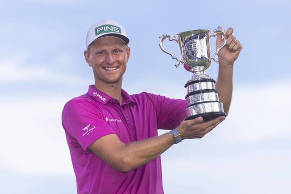 Adrian Meronk holds the trophy after winning the 2022 ISPS HANDA Australian Open at Victoria Golf Club in Melbourne. Picture: Daniel Pockett/Getty Images.
