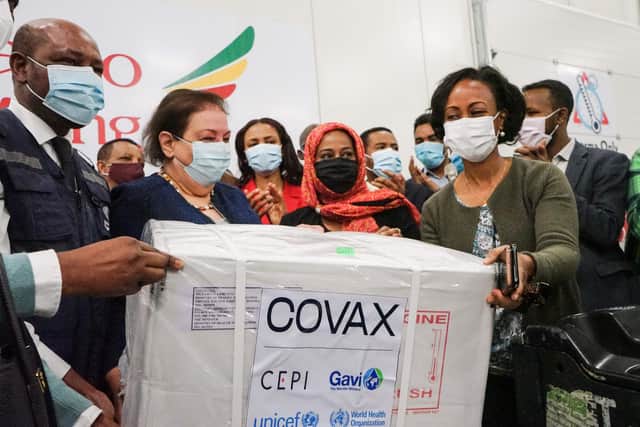 Ethiopia's Health Minister Lia Tadesse (right) receives a box of Oxford/AstraZeneca Covid-19 vaccines, delivered as a part of the UN-led Covax initiative which is working to facilitate vaccine access for poorer countries (Picture: Amanuel Sileshi/AFP via Getty Images)