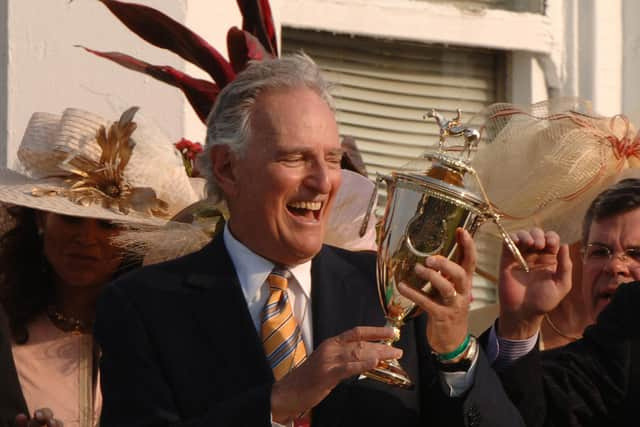 Jerry Moss celebrates a win for his horse and jockey at the Kentucky Derby in 2005 (Picture: A Messerschmidt/Getty Images)