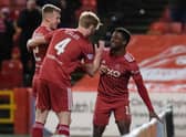 Aberdeen forward Duk is mobbed by his team-mates after scoring a brace in the 2-0 win over St Johnstone at Pittodrie.