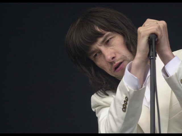 Bobby Gillespie, of Primal Scream, playing T in the Park in 2002.