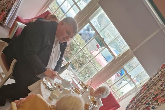 MP Chris Kane with residents at HC-One Scotland’s Annfield House Care Home chatting and enjoying afternoon tea