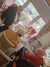 MP Chris Kane with residents at HC-One Scotland’s Annfield House Care Home chatting and enjoying afternoon tea