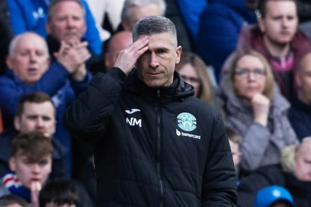 Hibs manager Nick Montgomery watches on as his team competed at Ibrox.