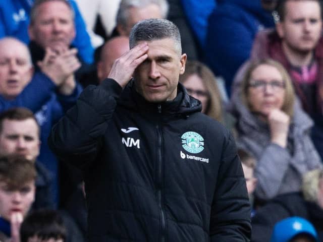 Hibs manager Nick Montgomery watches on as his team competed at Ibrox.