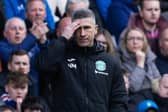 Hibs manager Nick Montgomery watches on as his team competed at Ibrox.