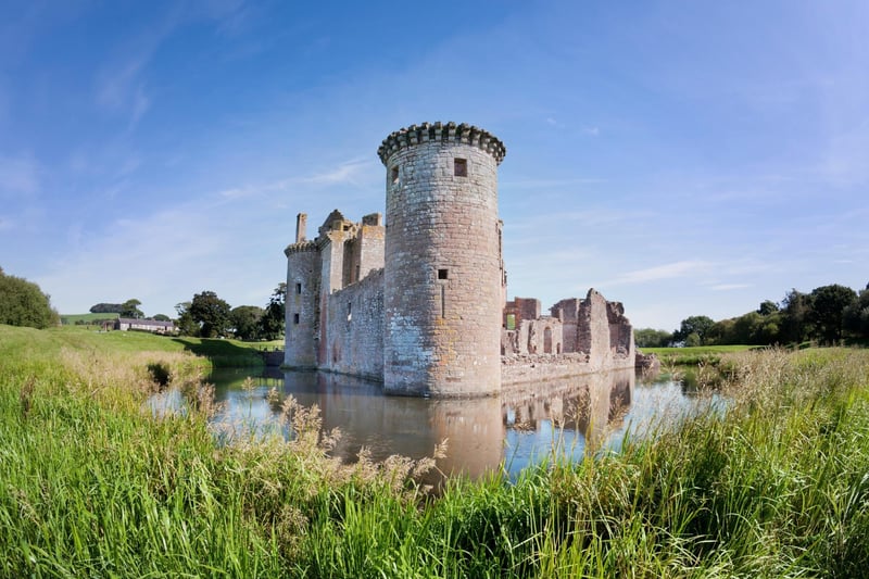 With its moat, twin towered gatehouse and battlements this castle can be thought of as very traditional but it is considered 'unique' to some on account of its triangular shape. It can be found east of the Scottish Borders in Dumfries.